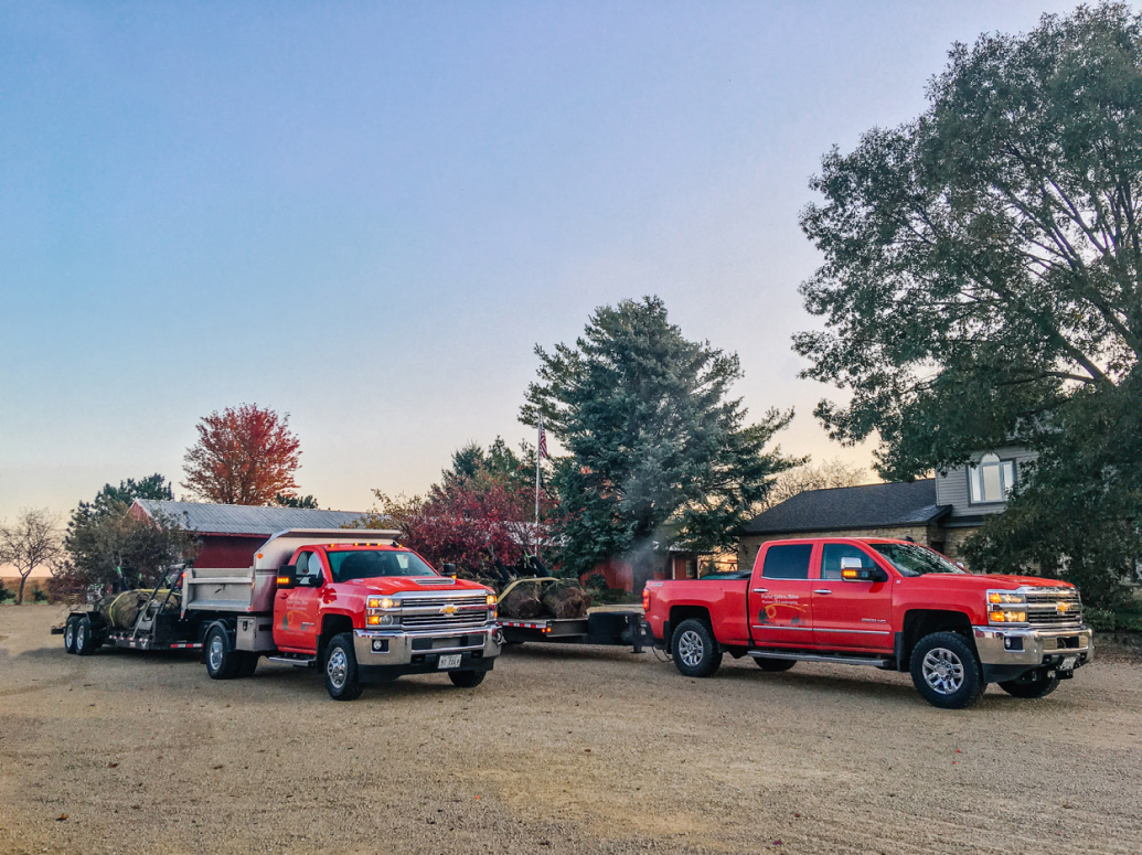 Forest Green Trees trucks and landscaping equipment